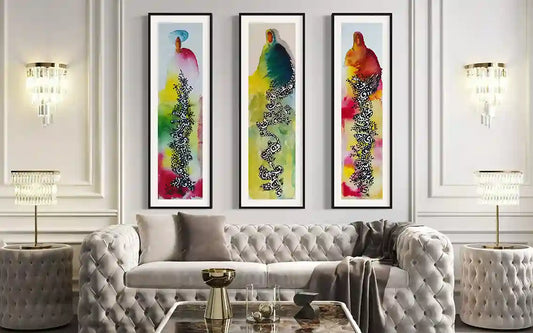 Gray tufted sofa with three framed art Prints 'Night-woven' above it in a living room setting. by artist Yousif Ibrahim- UAE