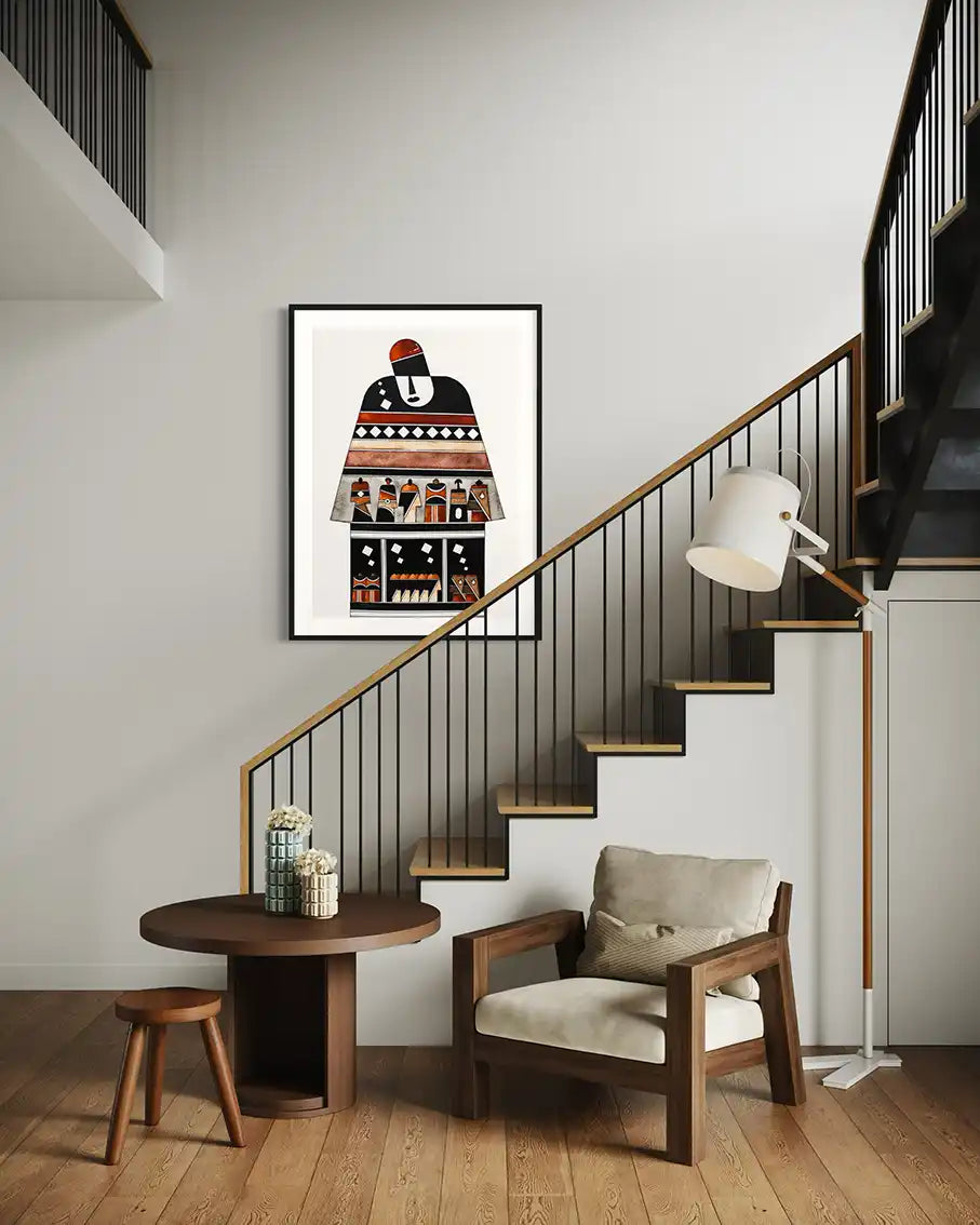 Modern interior with a staircase, chair, table, and framed artwork on the wall. 'Armory' print by artist Yousif Ibrahim - UAE