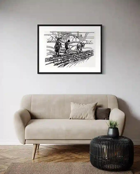 Black and white framed art print "Ground Notes" by Obada Gabir displayed above beige sofa in modern living room interior
