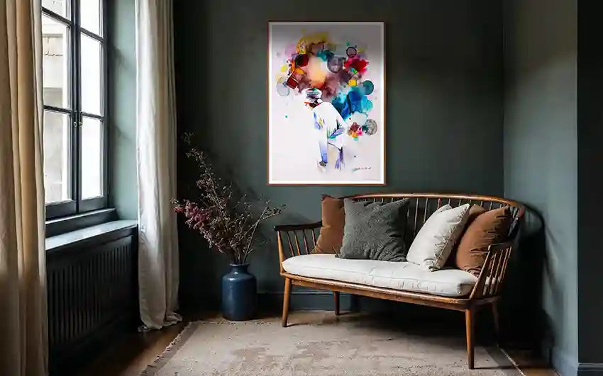 Nestled corner of a room with a wooden sofa, decorative vase, and colorful art print by artist Galal Yousif on a dark wall.