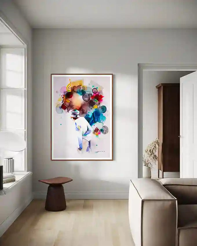 Modern interior with a large framed art print of Sudanese artist Galal Yousif on a wall with a Sudanese man in center, in UAE