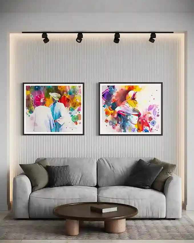 Gray sofa with two matching colorful abstract Framed art prints on a wall by visual Sudanese artist Galal Yousif.