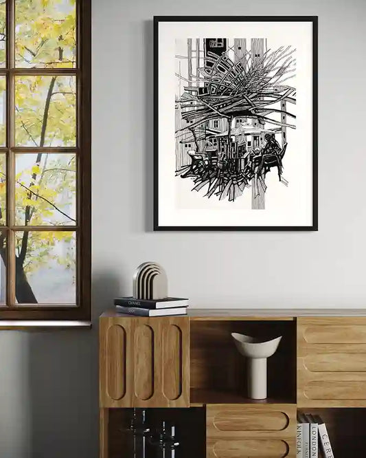 Urban tea vendor black and white line art print by Obada Gabir displayed in black frame on modern living room wall
