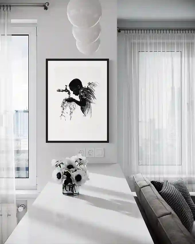 Thirst art print by Obada Gabir displayed in modern white living room with black frame, showing water faucet illustration
