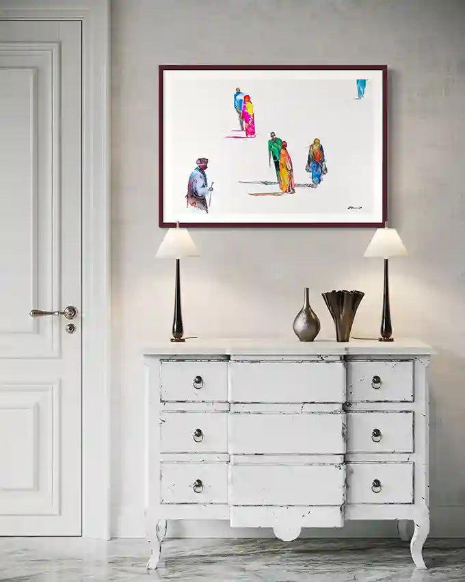 Framed art print by visual Sudanese artist Galal Yousif above a white dresser with decorative items. available in UAE