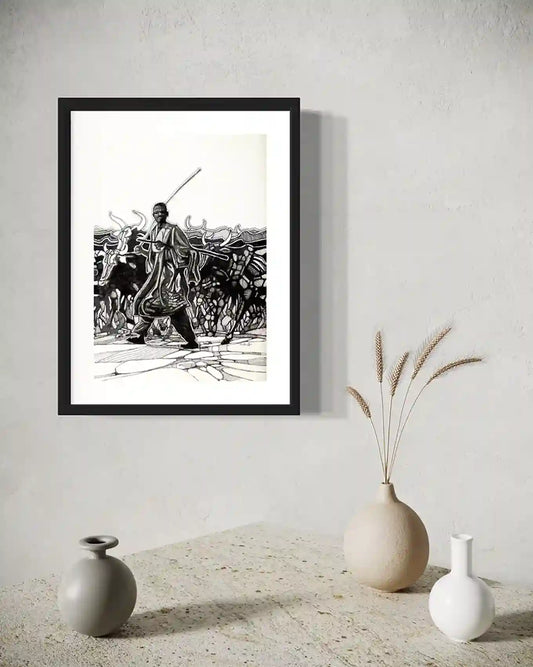 The Cattle Herder framed art print by Obada Gabir displayed in modern interior with ceramic vases and dried grass
