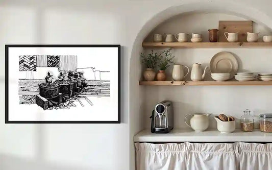 Cooking Pots black and white art print by Obada Gabir displayed in rustic kitchen pantry with ceramic dishes and natural shelving