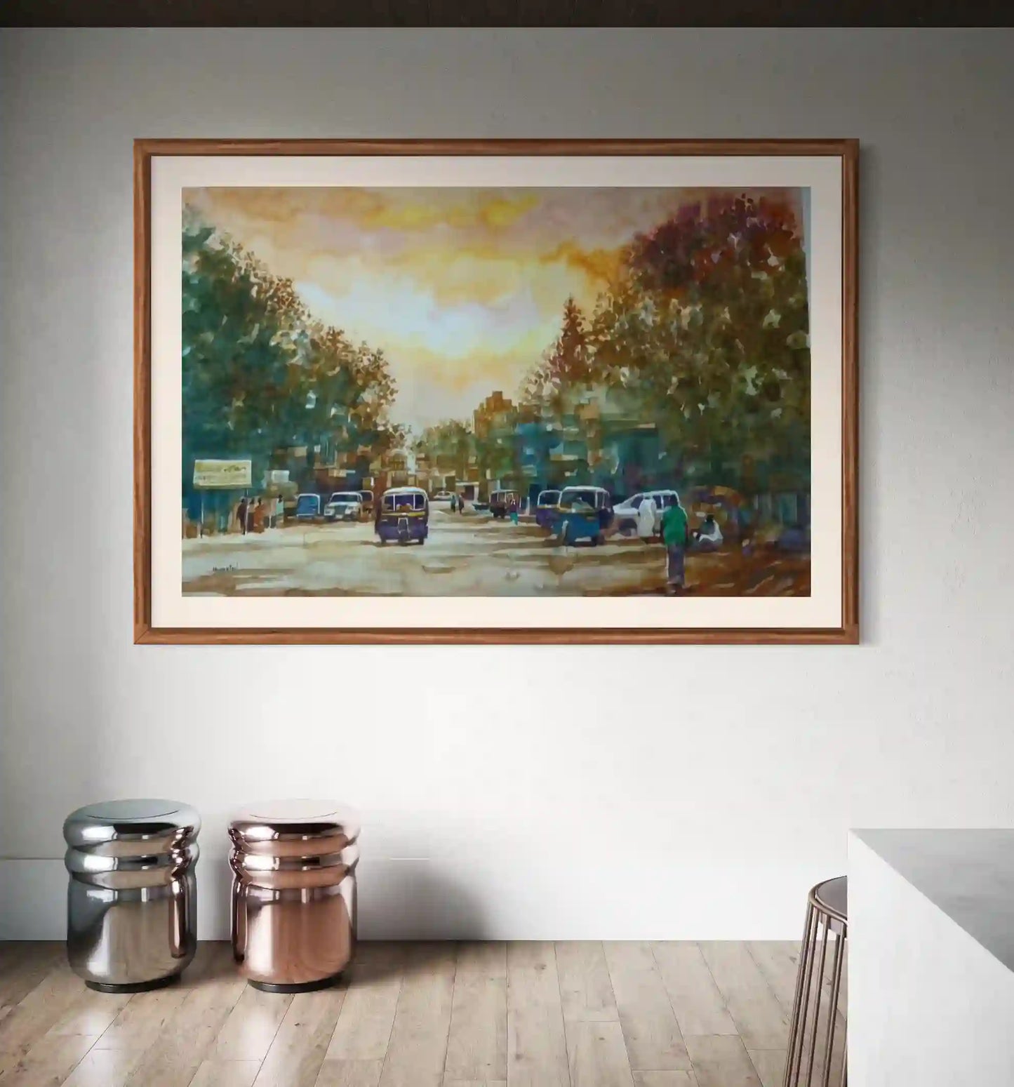 Golden Hour watercolor by Hussein Merghani displayed in wooden frame above metallic containers in modern interior design