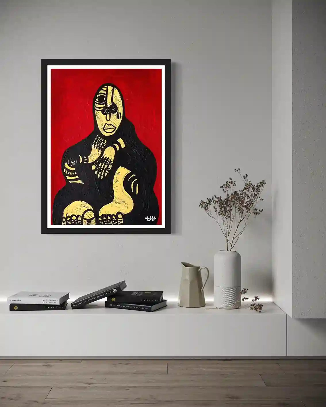 "Haboba" by Usra Hamza art print in black frame on gray wall above white shelf with books and decorative vase with flowers