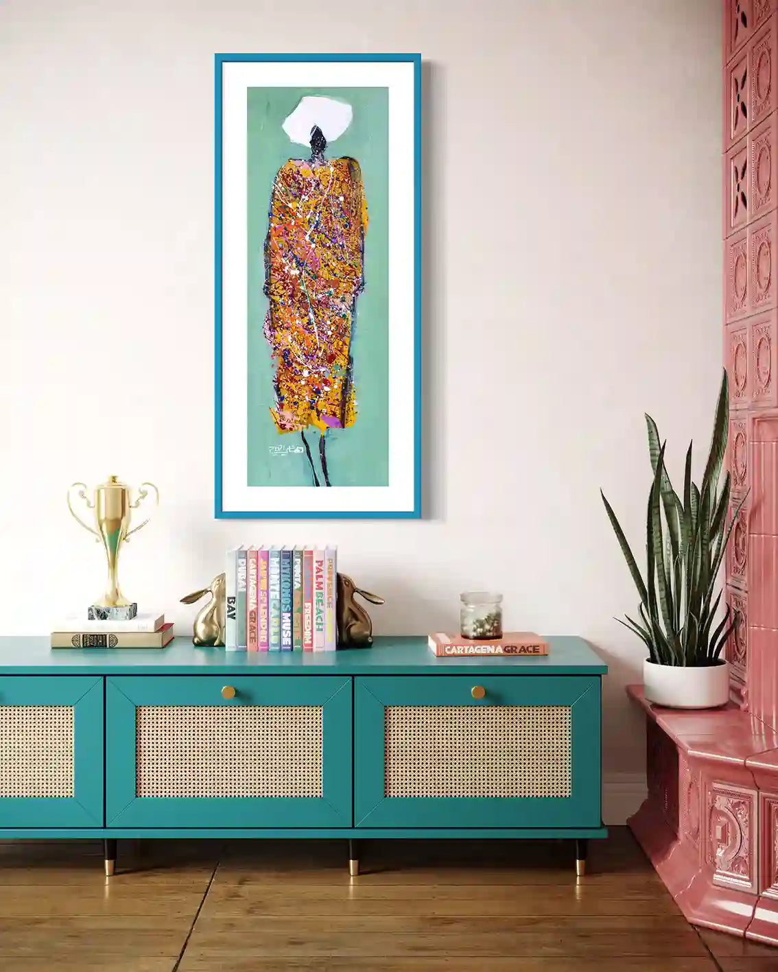Sufi 6 art print by Hani Khalil in turquoise frame above teal console with books, plant and decorative objects
