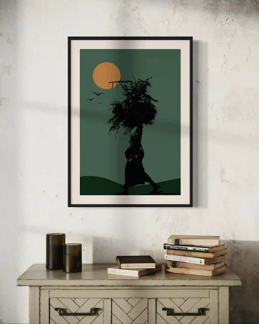 In Silhouette 3 framed art print on console table with books, African woman silhouette sunset landscape wall art