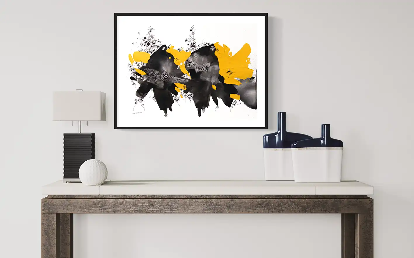 Path of Mothers abstract art print by Khalid Yan in black frame above modern console with decorative objects in office space