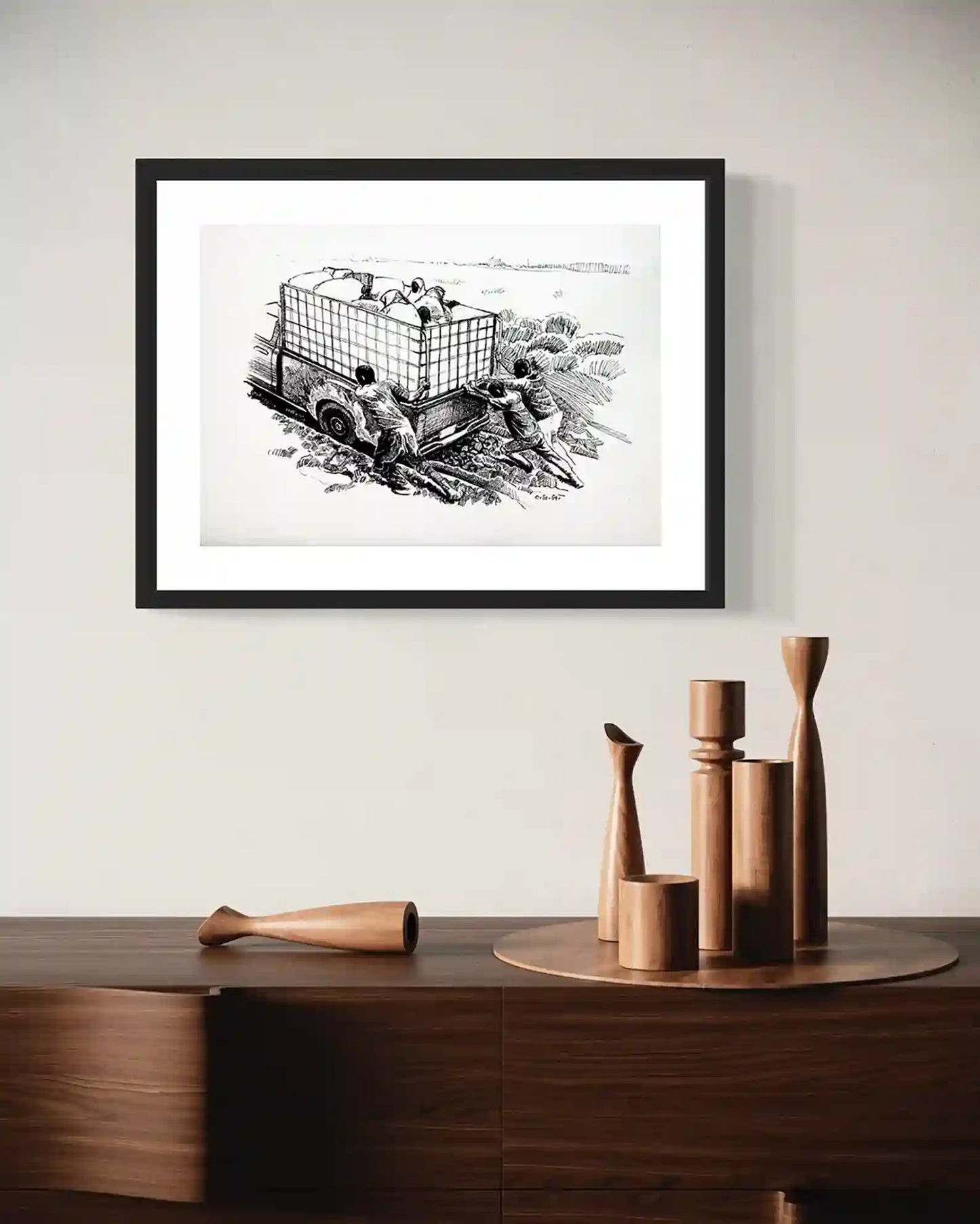 Framed ink painting 'Stuck on the Mud' by Obada Gabir on modern wall with wooden decor - wall art mockup display