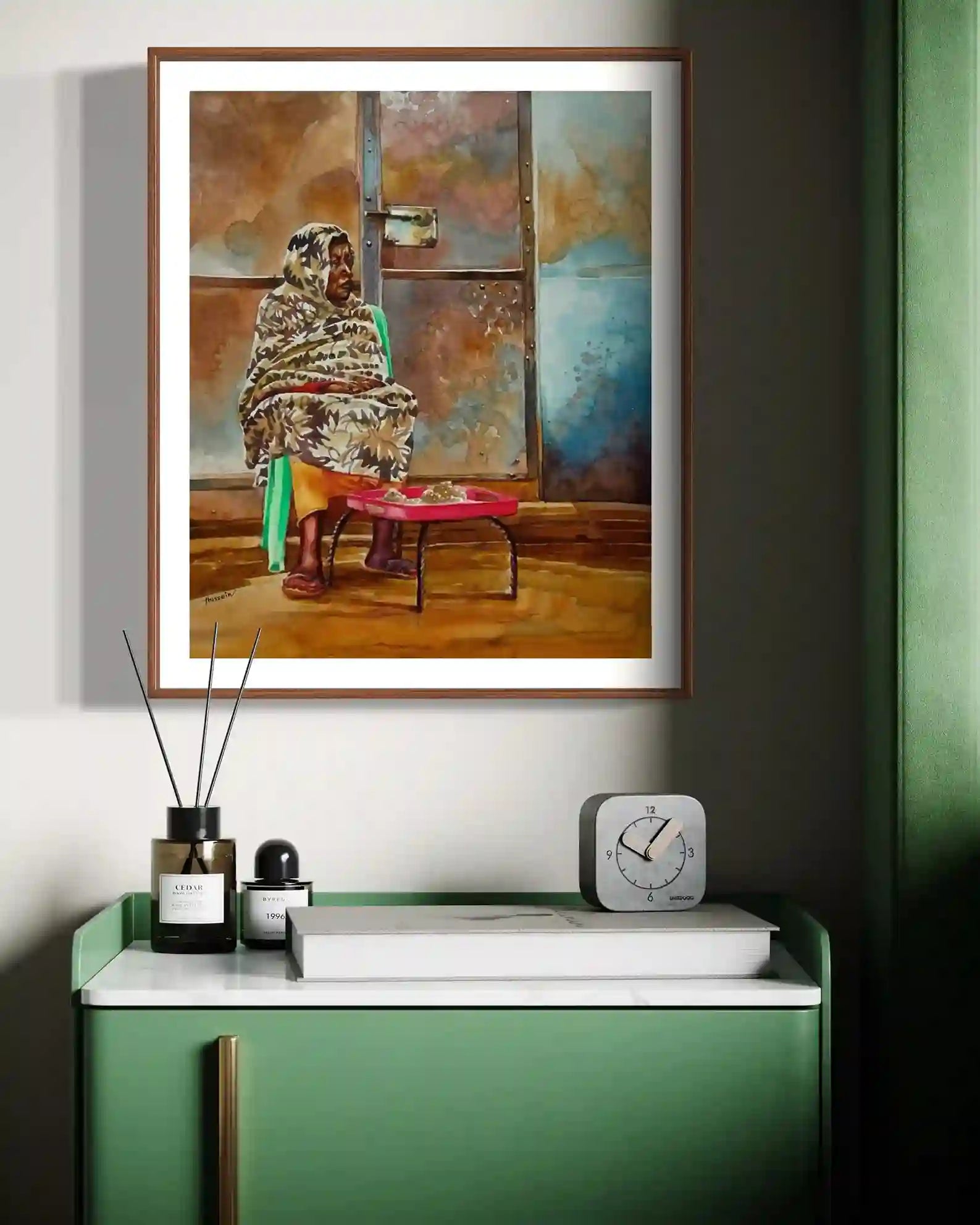 Quiet Afternoon watercolor by Hussein Merghani displayed in wooden frame above green console with modern home decor styling