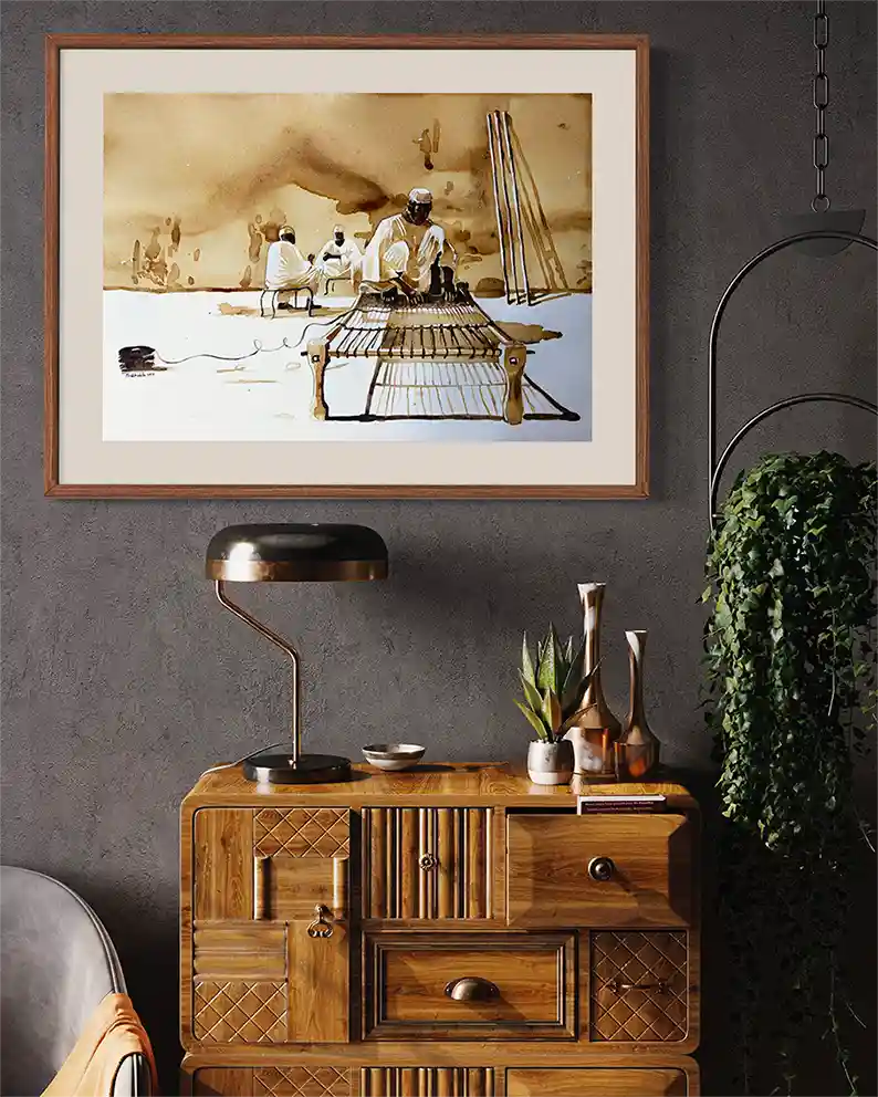 Coffee Chronicles: The Rope Weaver art print mockup by Salih Abdo showing framed Sudanese weaving scene in modern interior