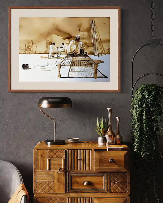 Coffee Chronicles: The Rope Weaver art print mockup by Salih Abdo showing framed Sudanese weaving scene in modern interior