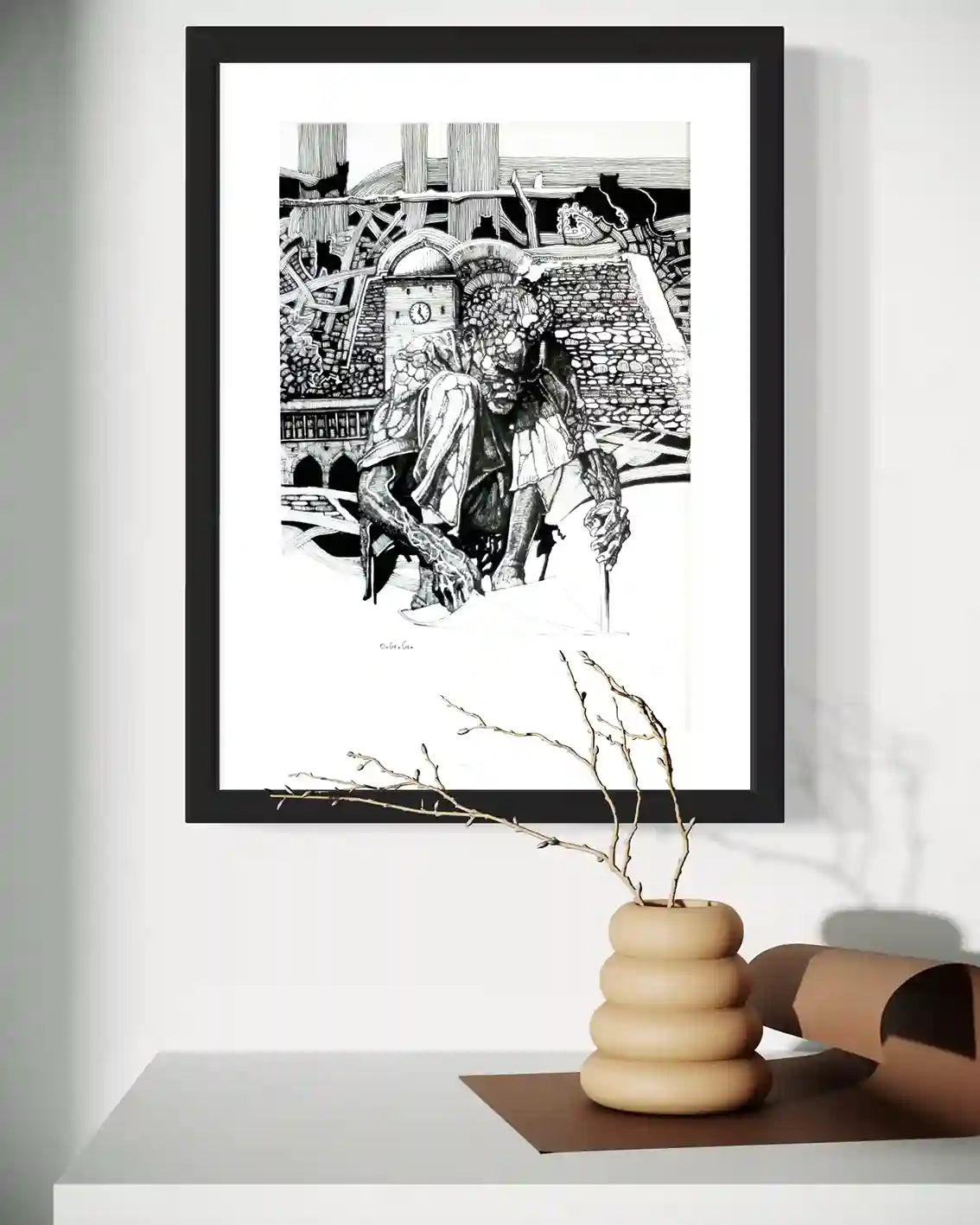 Shadow of Time by Obada Gabir framed ink painting mockup on wall above wooden shelf with ceramic vase and branches