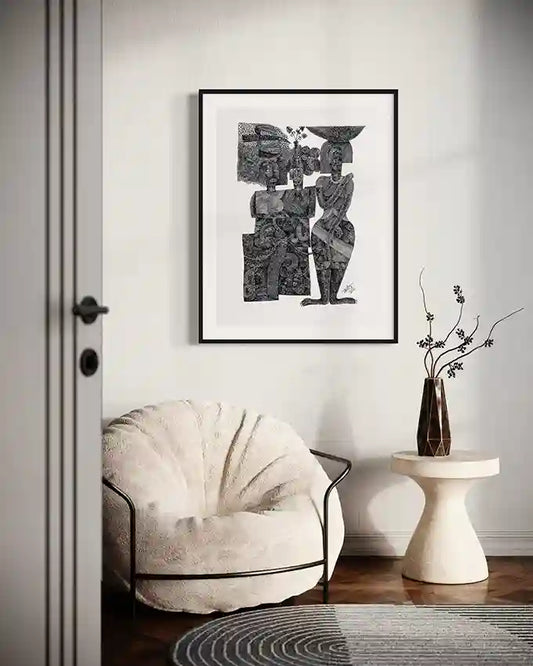"Sisterhood" art print by Tariq Nasre displayed in modern living room with cream armchair and sculptural side table