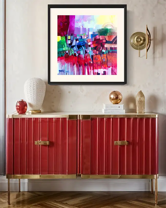 The Space Between Us framed art print by Rafat Omar displayed above red credenza in modern interior room mockup