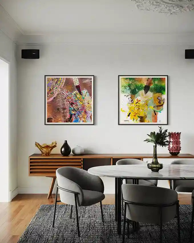 Sufi 13 & Sufi 12 art prints by Hani Khalil as gallery wall pair above modern dining credenza with round table & contemporary chairs
