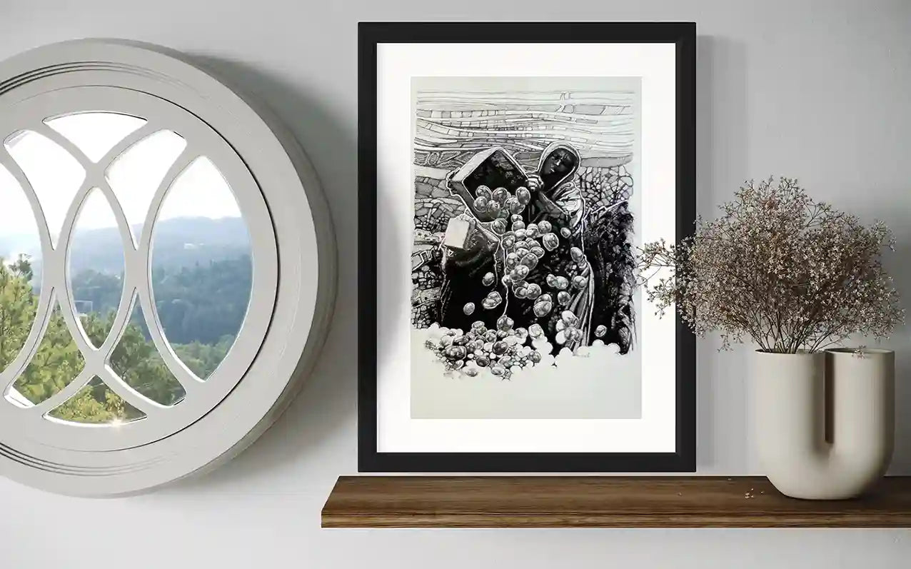The Harvest ink drawing by Obada Gabir framed in black frame, displayed in modern interior with window and vase