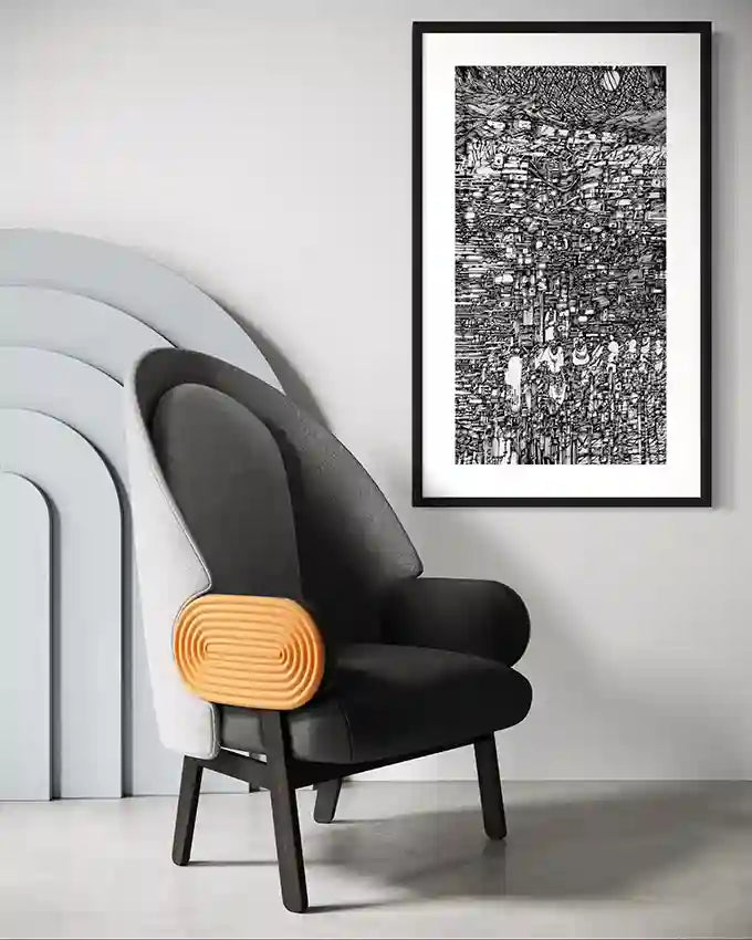 The Weight of Sky" vertical art print by Osman Gouma displayed above modern black chair with wooden accent pillow