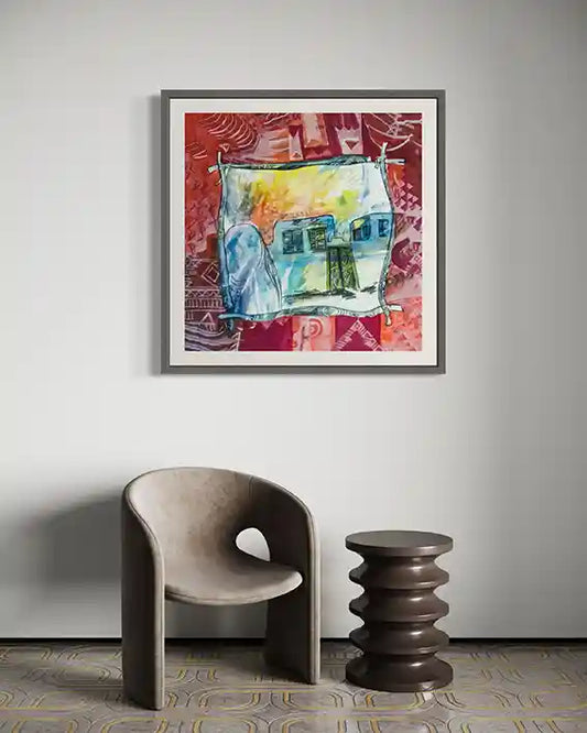 Framed art print "Through The Veil" by Abdelmageed Afifi displayed on wall above modern chair, showing Nubian watercolor artwork
