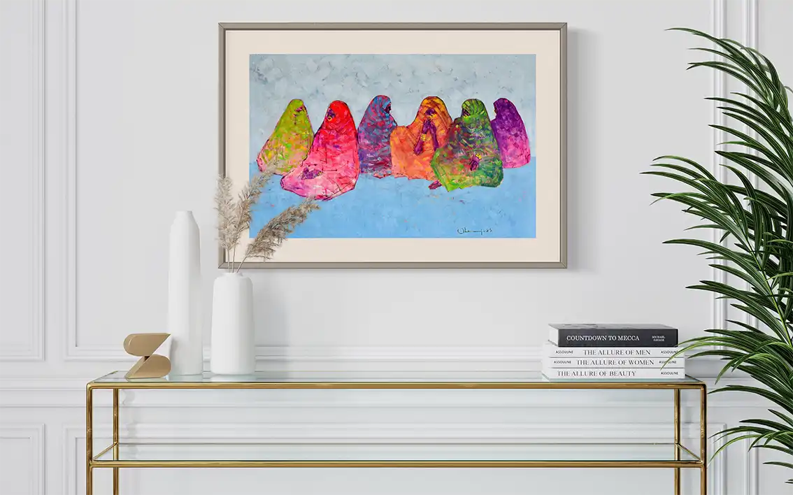The Veiled Rainbow by Mohamed Ohaj framed art print mockup in modern white interior with gold console table and palm plant