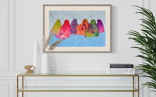The Veiled Rainbow by Mohamed Ohaj framed art print mockup in modern white interior with gold console table and palm plant