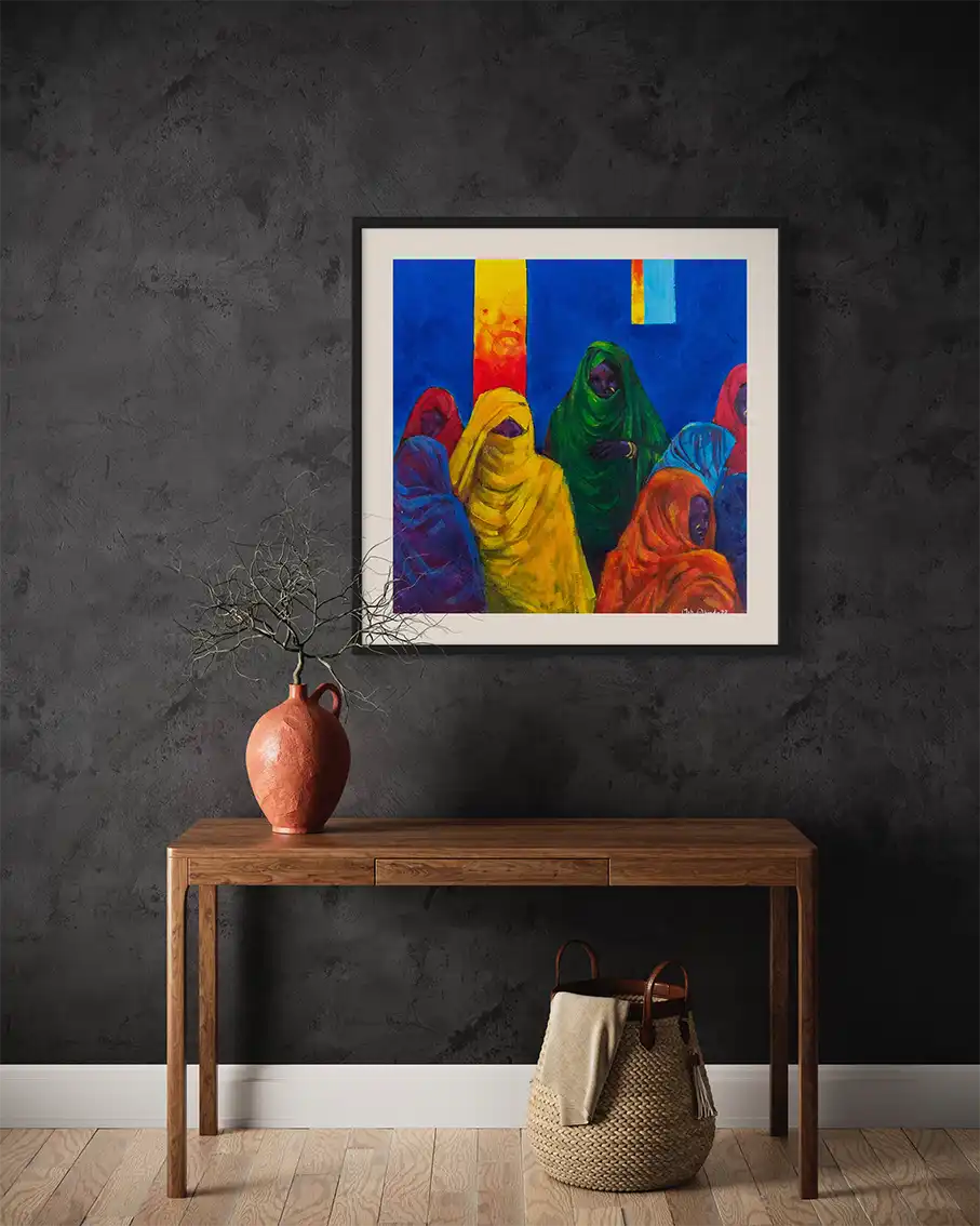 Veiled Voices by Mohamed Ohaj framed art print mockup on dark wall with wooden console table, pottery and woven basket decor