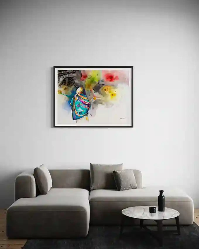 Colorful Framed art print  by Sudanese Artist Galal Yousif on a wall above a gray sofa in a living room. UAe 