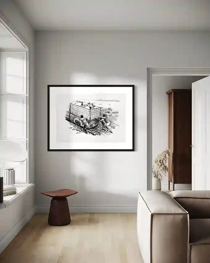 Modern living room with gray walls, wooden stool, and framed "Stuck in the Mud" vintage art print by Obada Gabir