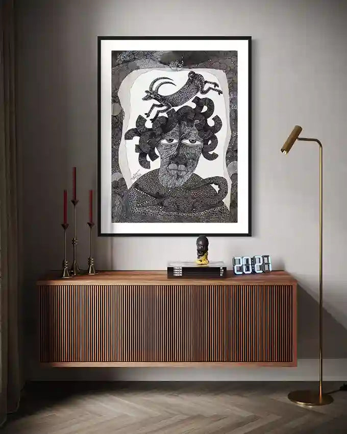 "The Storyteller" art print above wooden floating console with brass candlesticks and modern floor lamp.