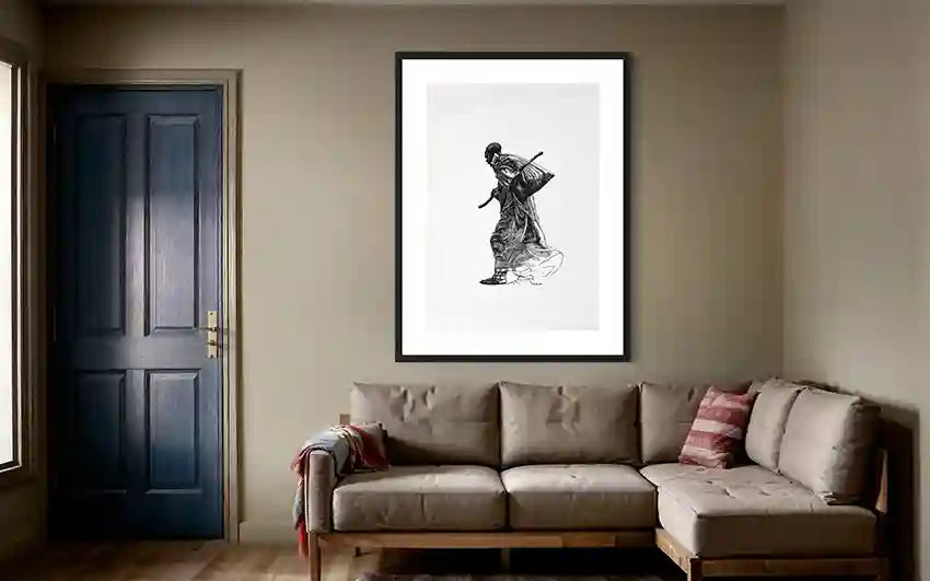 The Unseen art print by Obada Gabir framed in black hanging above modern beige sectional sofa in contemporary living room