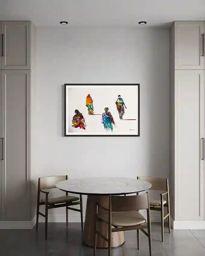 Dining room with a round table and chairs, featuring a colorful framed print by Sudanese artist Galal Yousif on the wall. UAE
