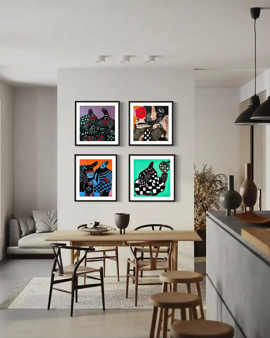 Four framed original artworks by Usra Hamza in gallery wall above dining table, abstract figures with checkered patterns