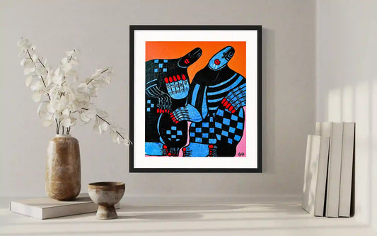 Connection art print by Usra Hamza in black frame on wall with minimalist decor, abstract figures in blue and orange tones