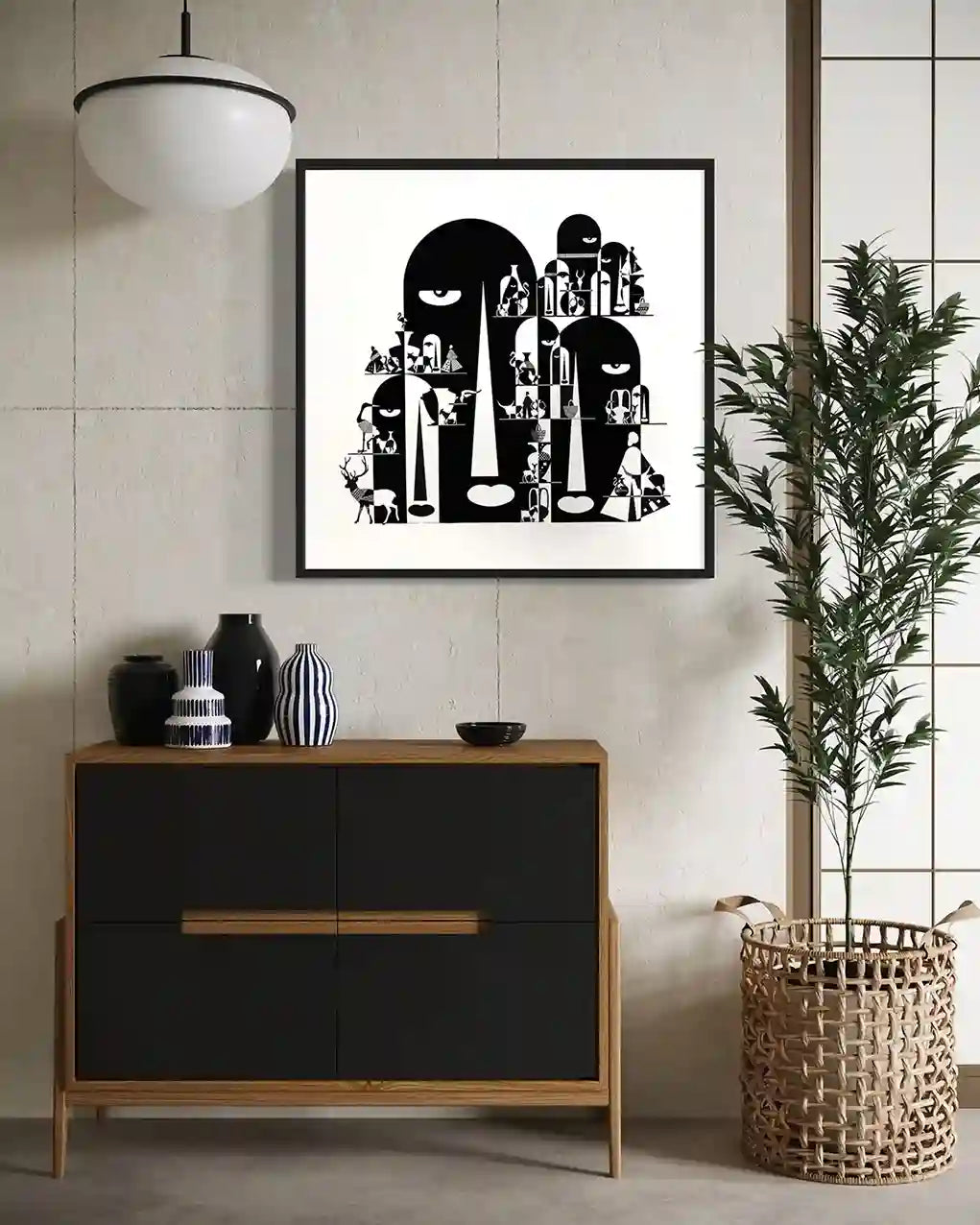 Tombs black and white art print by Gungalito in black frame displayed in modern living space with sideboard and plant