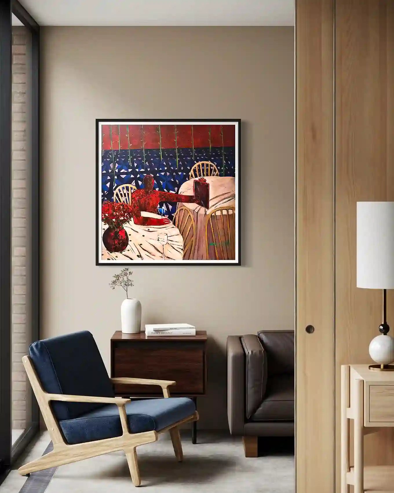 In Waiting by Yasmeen Abdullah framed print in modern living room with blue chair and minimalist contemporary decor