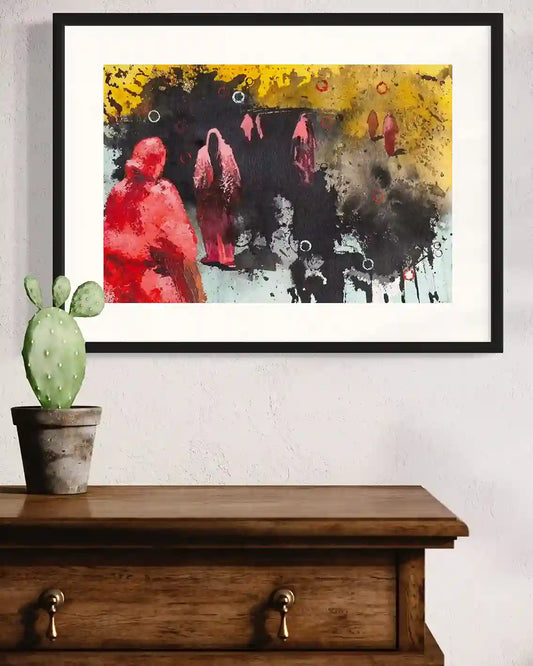 'Remnants 4' art print by Bakri Moaz displayed in black frame above wooden console with cactus plant decor